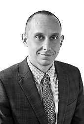 FRANK KOLENKO Black and white headshot of Frank Kolenko