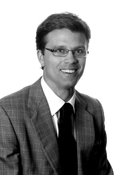 Black and white headshot of Kieran C. Dickson