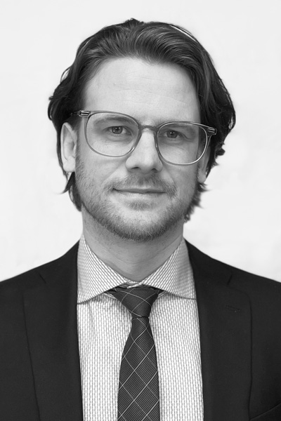 Black and white headshot of Dan MacDonald